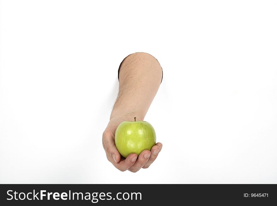 Hand is holding green apple