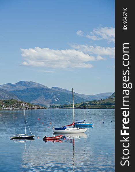 Tranquil image of  yachts moored on Loch Broom, Ullapool. Tranquil image of  yachts moored on Loch Broom, Ullapool.