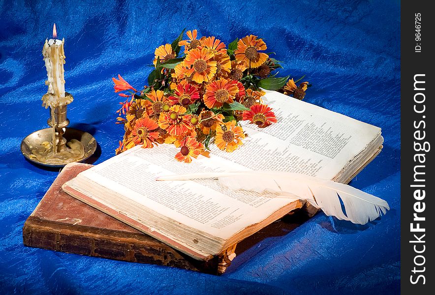 Still life with a candlestick and books. Still life with a candlestick and books