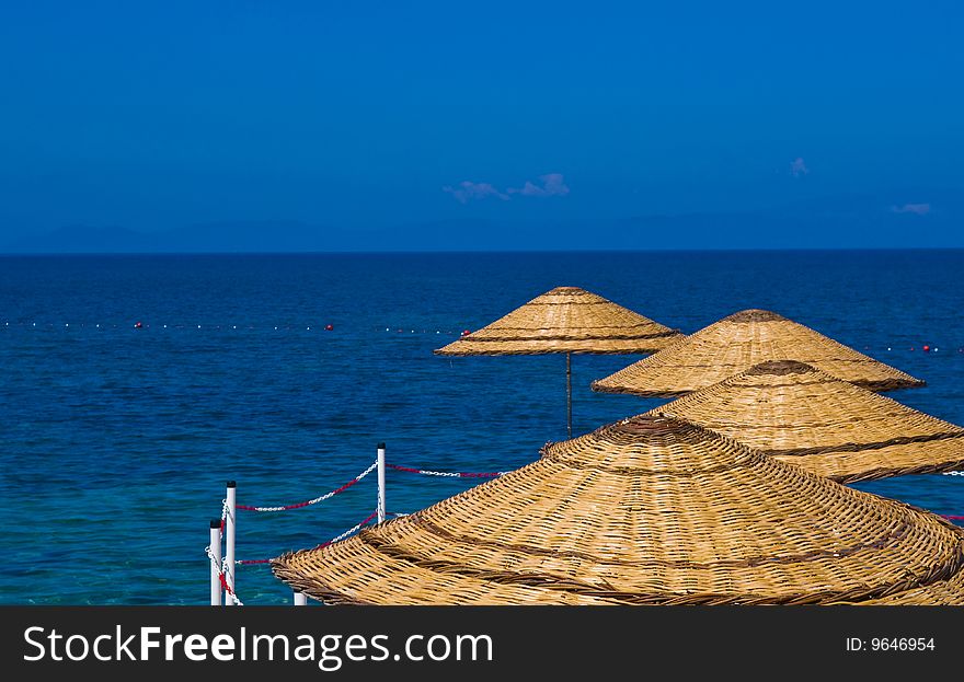 Sunshades in Turkish resort in the Aegean sea