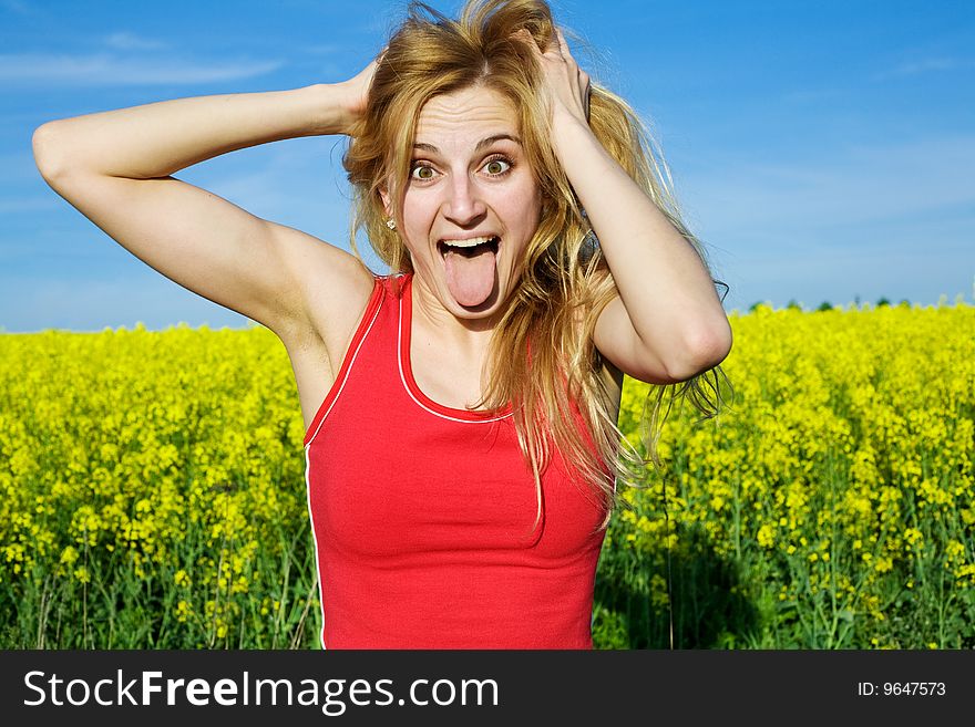 An image of a funny girl on a background of yellow field