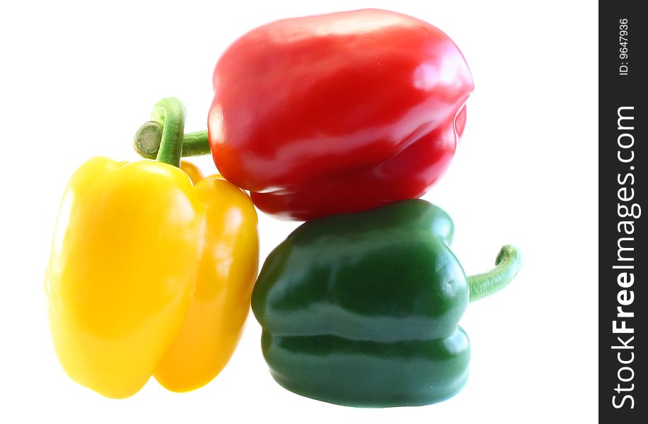 Red, yellow and green pepper, on a white background.