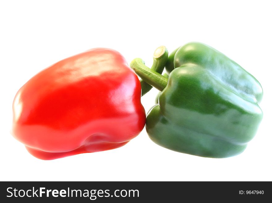 Red and green pepper, on a white background.