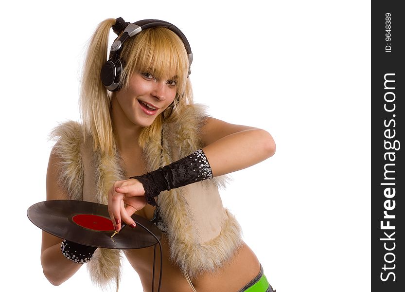 Young girl in  waistcoats of the fur, with plate in hand and headphones. Young girl in  waistcoats of the fur, with plate in hand and headphones