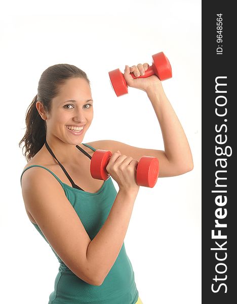 Young woman exercising with red dumbbell, wearing sporting outfit. Young woman exercising with red dumbbell, wearing sporting outfit.