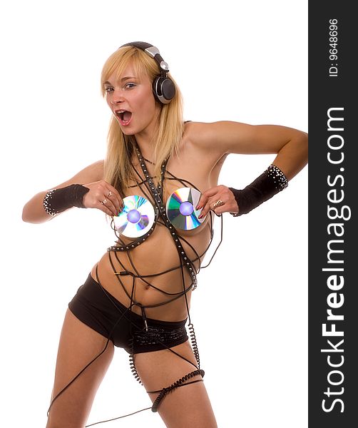 Sexual young girl with discs on the nipple and the headphones on a light background. Sexual young girl with discs on the nipple and the headphones on a light background