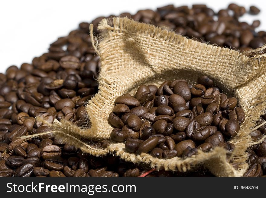 Photo of coffee beans in a bag of iuta - white background
