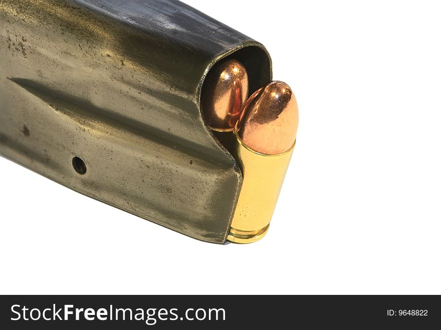 Conventional 9mm bullets loaded in a magazine, isolated on a white background. Conventional 9mm bullets loaded in a magazine, isolated on a white background