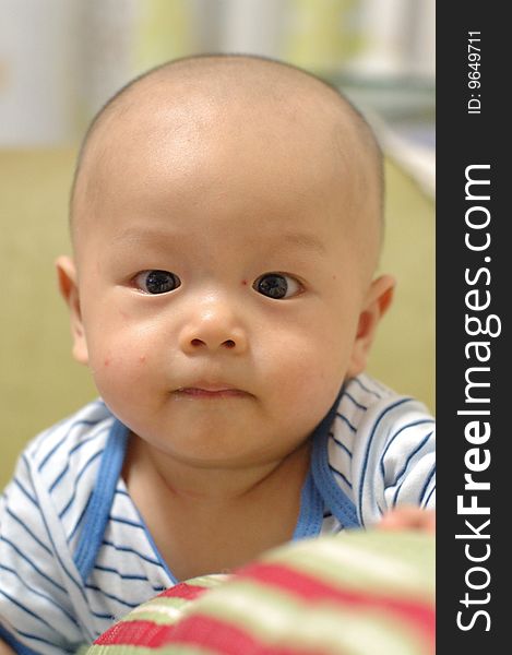 It is a cute chinese baby, isolated. he is 5 months. It is a cute chinese baby, isolated. he is 5 months.