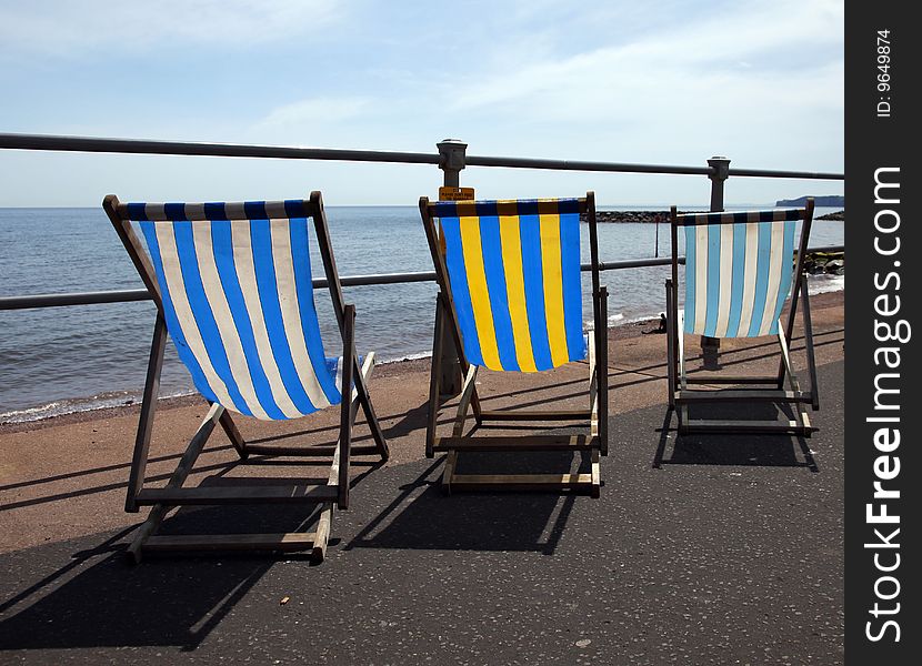 Traditional summer scene consisting of deck chairs along the esplanade. Traditional summer scene consisting of deck chairs along the esplanade