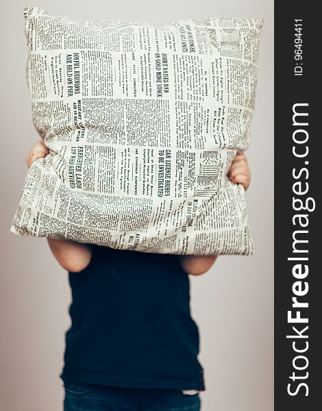 Person In Black Shirt Cover His Face With Newspaper Design Throw Pillow