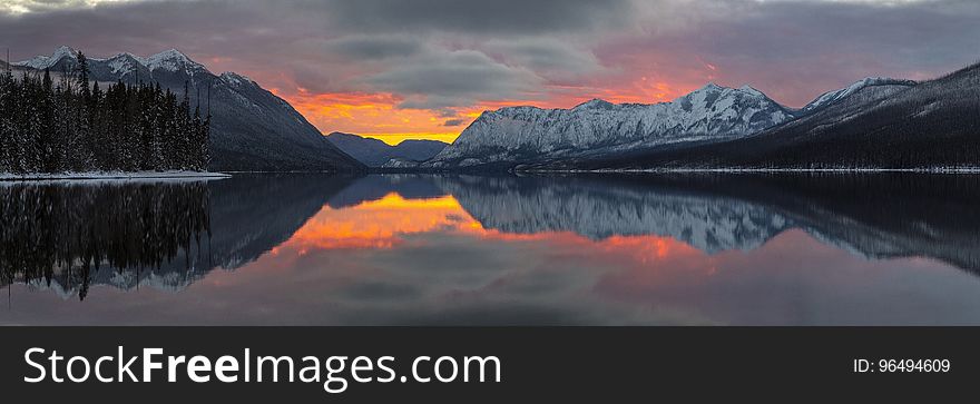 Reflection Of Mountains In Lake During Sunset