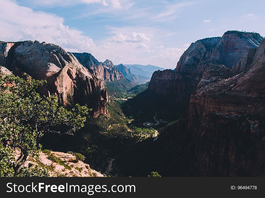 Scenic View of Mountains Against Cloudy Sky