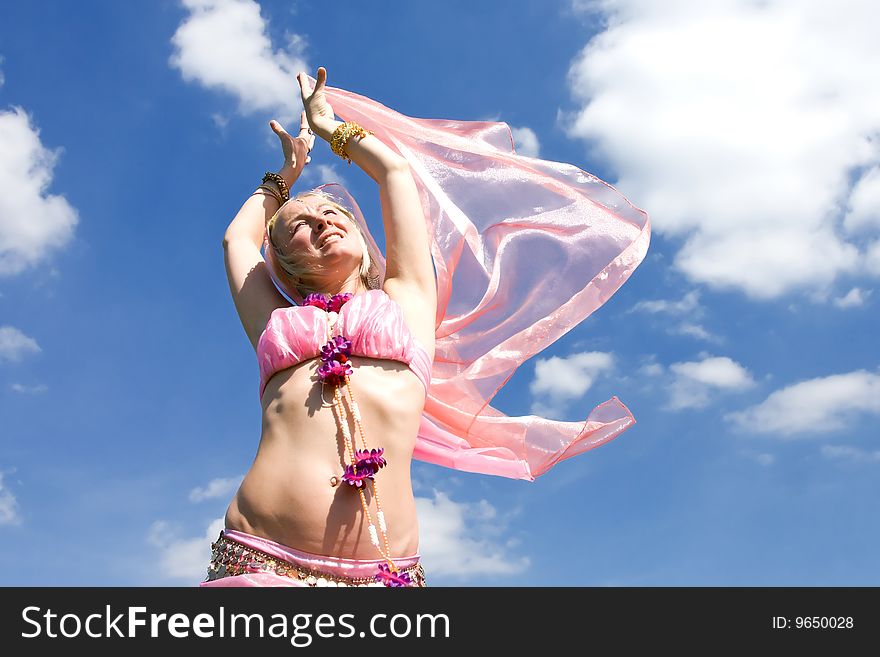 A Woman Dancing And A Blue Sky