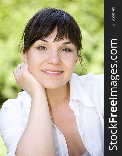 Happy woman relaxing on grass. Happy woman relaxing on grass