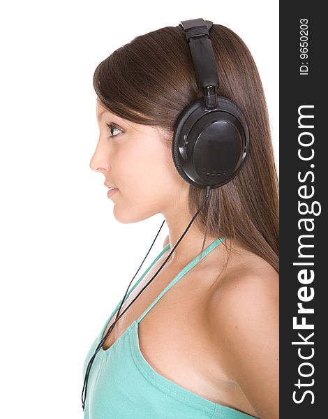 Pretty teen with headphones. over white background. Pretty teen with headphones. over white background