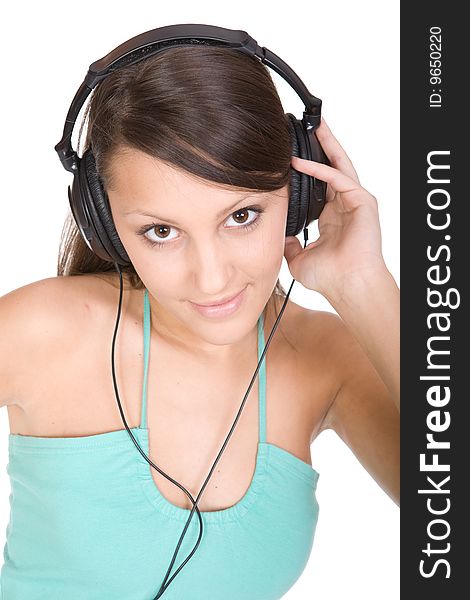 Pretty teen with headphones. over white background. Pretty teen with headphones. over white background