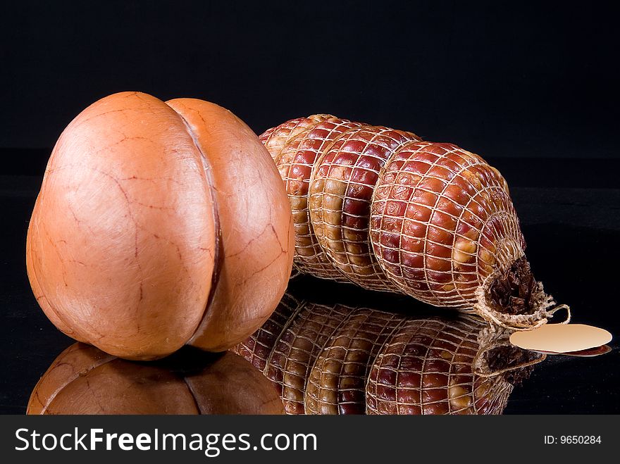 Sausages on a black glass background