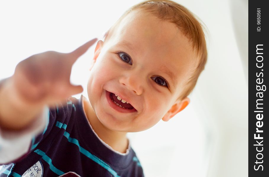 Closeup portrait of little boy smiling on white. Closeup portrait of little boy smiling on white