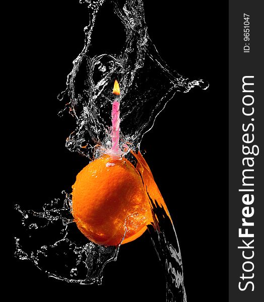 Orange With Candle In Water Splash