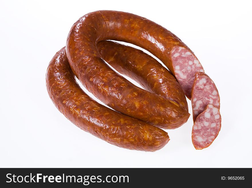 Piece of sausage on isolated background
