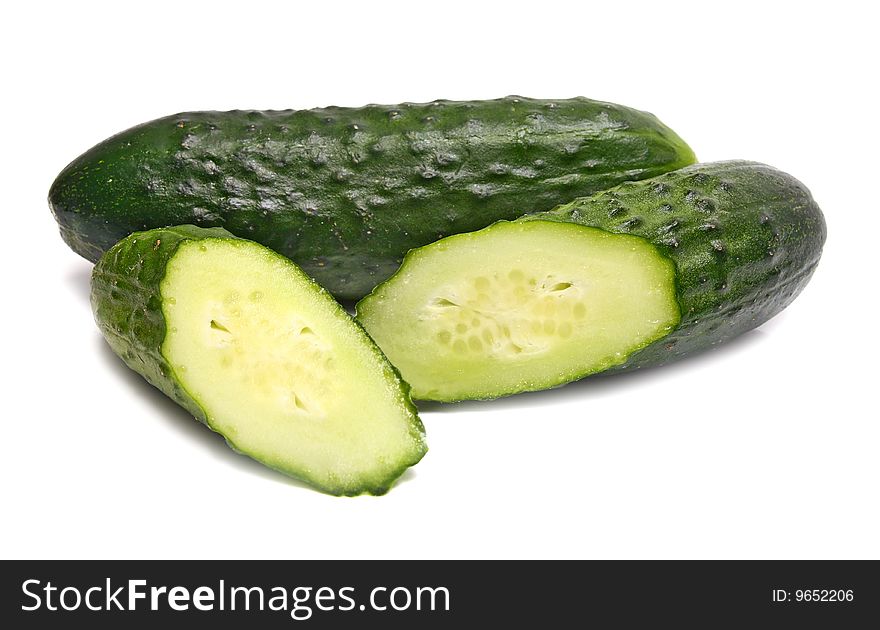 Cut green cucumbers isolated on white background. Cut green cucumbers isolated on white background