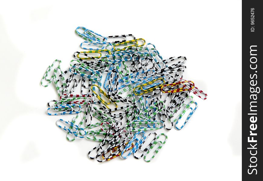 Group of colored paperclips isolated over white