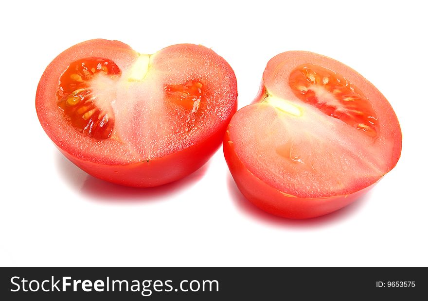 Ripe tomatos cut isolated on white background