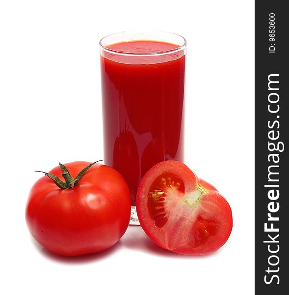 Tomatos and juice in glass isolated on white background