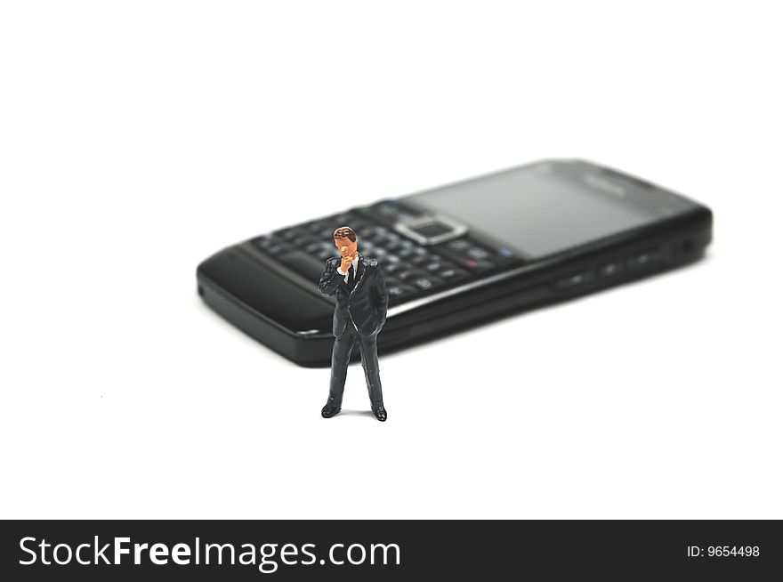 A businessman in front of a smartphone. A businessman in front of a smartphone