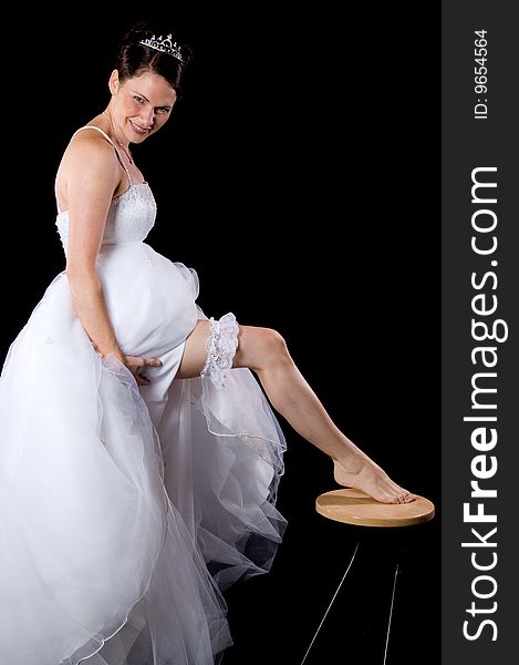 White Bride at her wedding posing with veil