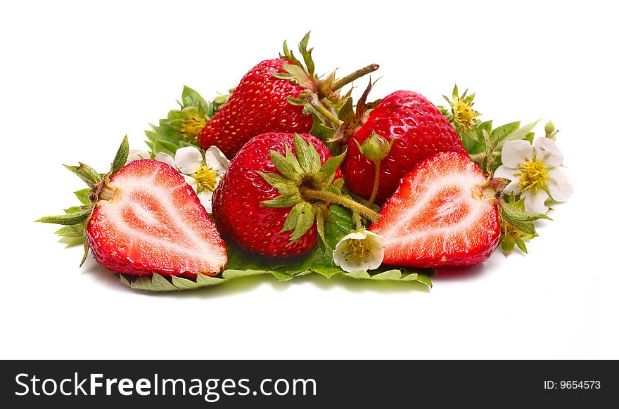 Strawberry slice and blossom isolated on white background