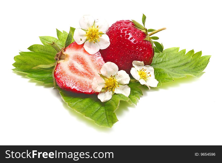 Strawberry slice and blossom isolated on white background