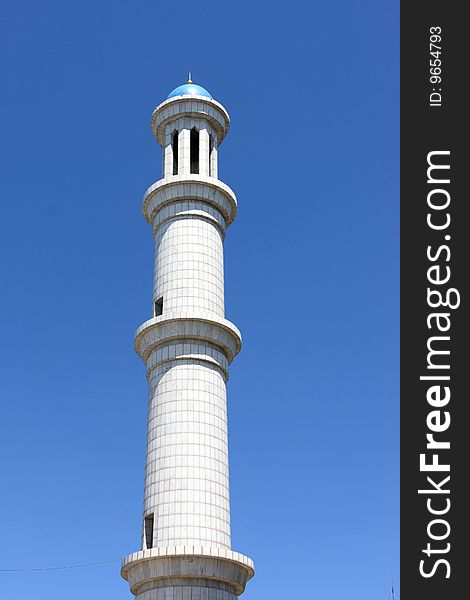 The high marble minaret in Almaty, Kazakhstan. The high marble minaret in Almaty, Kazakhstan