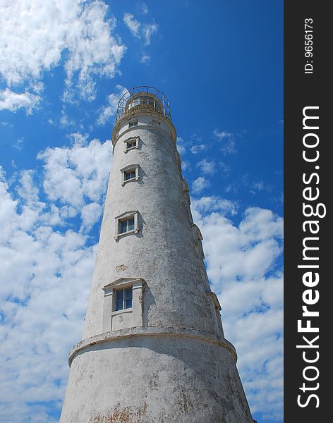 Lighthouse on a background blue sky