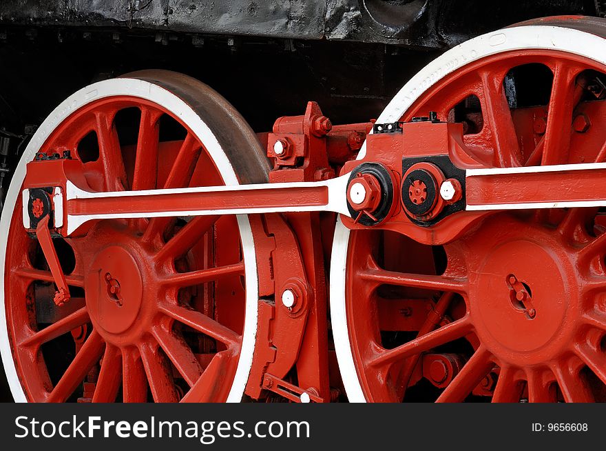 Red wheels of an old steam locomotive. Red wheels of an old steam locomotive