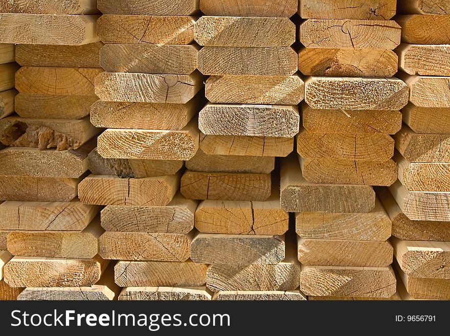 Sawed wooden boards laid in a heap