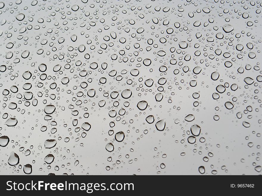 Rain drops on grey background