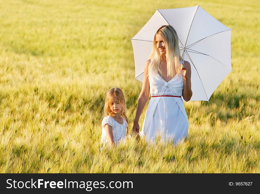 Mother and dauther in green field. Mother and dauther in green field