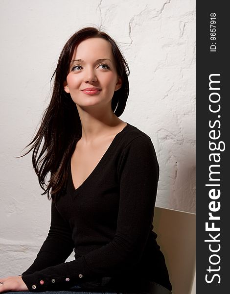 The young beautiful woman, portrait in studio. The young beautiful woman, portrait in studio