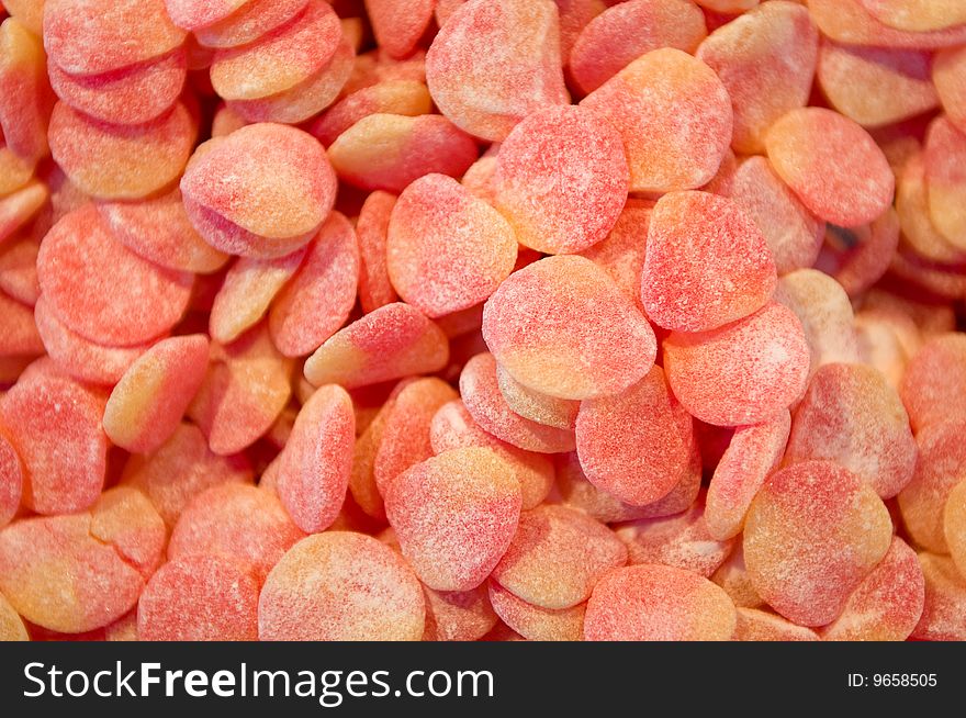 Close up of red and orange jelly beans background - Texture. Close up of red and orange jelly beans background - Texture