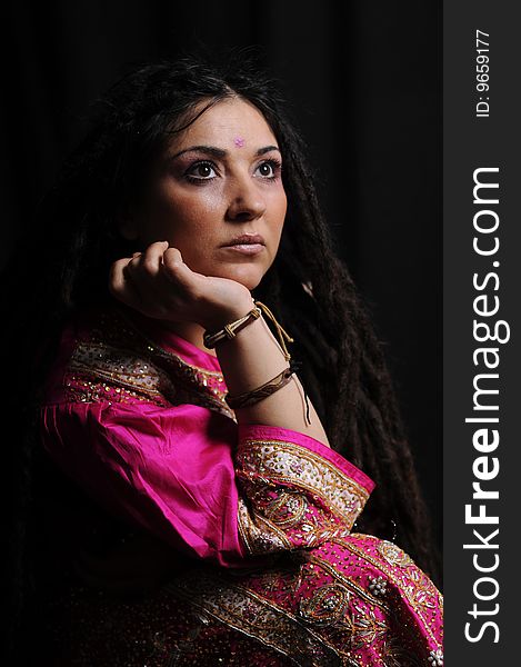 A beautiful Indian woman wearing a traditional sari