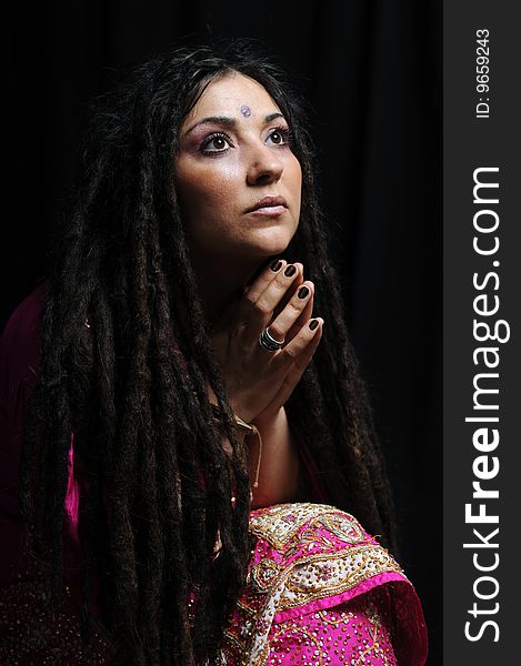 A beautiful Indian woman wearing a traditional sari