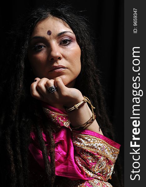 A beautiful Indian woman wearing a traditional sari