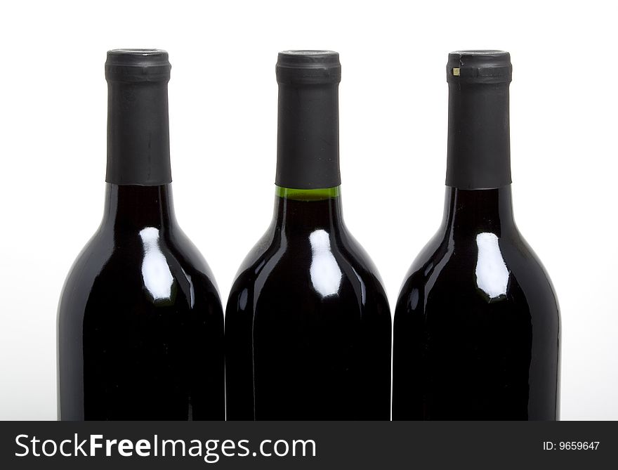 Three bottles of wine isolated on white