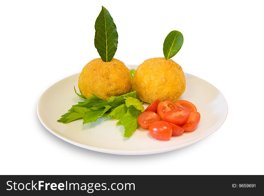 Rice meatballs decorated with cherry tomatoes, celery and bay laurel. Italian food. Rice meatballs decorated with cherry tomatoes, celery and bay laurel. Italian food