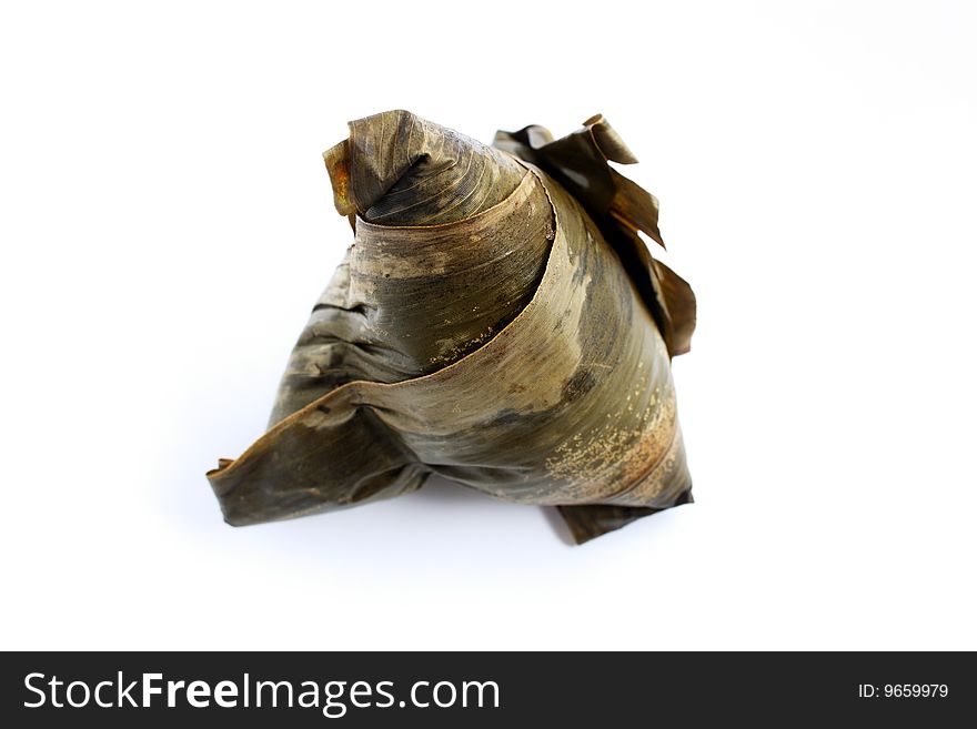 A rice dumplings (Chinese traditional food) isolated on white background. A rice dumplings (Chinese traditional food) isolated on white background.