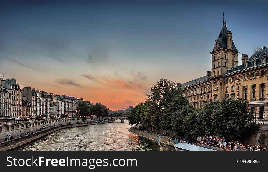 Green Trees Near Yellow Concrete Building Under Cloudy Blue Sky during Sunset