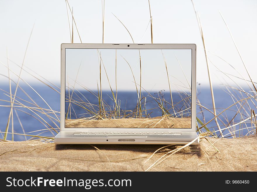 Image of laptop on a beach. Image of laptop on a beach