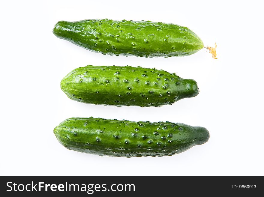 Three cucumbers on isolated background